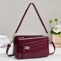 Elegant wine red patent leather crossbody bag with faux crocodile texture and gold hardware - Red