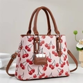 Pink cherry pattern tote bag with brown handles and a mini bag charm pendant - Pink