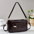 Dark brown patent leather handbag with crocodile pattern and golden metal twist lock - Coffee