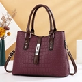 Elegant burgundy crocodile-patterned handbag with contrast handles and silver hardware - Burgundy