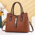 Brown crocodile embossed leather handbag with silver turn-lock and top handle - Brown