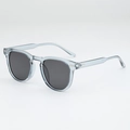 Fashionable round sunglasses featuring light grey-blue frames and silver rivet accents - Translucent Grey Frame Grey Lens