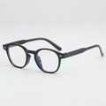 Lunettes de soleil rétro à monture ovale noire, rivets argentés et verres bleus - Protection UV400 / Monture Noire Verres Transparents