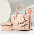 Detail of pink faux leather bag with lychee grain texture and golden metal hardware - Pink