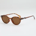 Vintage tortoise shell oval sunglasses featuring brown lenses and chic diamond metal accents - Sunglasses / Tortoise Shell Frame