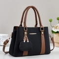 Black herringbone fabric handbag with brown leather straps and gold metal details - Black