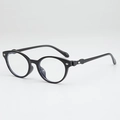 Schwarze ovale Sonnenbrille mit silbernen Metalldetails in Rautenform und getönten Gläsern - Blaulichtschutz / Schwarzer Rahmen Anti-Blaulicht