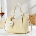 Contrast color bucket bag with woven texture, cream leather trim and plush charm - Off-white