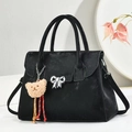 Elegant black suede handbag with silver bow detail and bear charm for women - Black