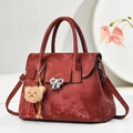 Retro burgundy shoulder bag with metallic bow detail and teddy bear charm accents - Wine Red