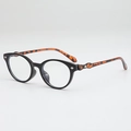 Ovale schwarze Sonnenbrille mit Bügeln in Schildpatt-Optik und Metall-Applikation - Blaulichtschutz / Schwarzer Rahmen Schildpatt Bügel Anti-Blaulicht
