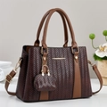 Large dark brown woven tote bag with smooth leather trim and adjustable shoulder strap - Coffee