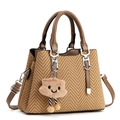 Fashionable woven tote bag with brown leather handles and a cute cloud charm accessory - Khaki/Earth Yellow