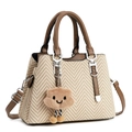 Women's woven shoulder bag in beige and brown chevron pattern with plush charm - Khaki