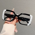 Detail shot of punk style square glasses featuring rivets and white color-block contrast - White Edge Black Frame