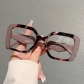 Detail shot of leopard print frames showing rivet decor and internal size marks - Coffee Edge Leopard Frame