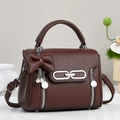 Deep brown lychee grain handbag with pearl bow pendant and adjustable strap - Coffee