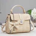 Elegant beige woven texture handbag with silver lock and pearl butterfly charm accessory - Khaki