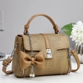 Detail of khaki woven texture handbag with pearl pendant and metal turn-lock closure - Olive Green