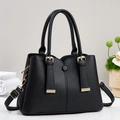 Black litchi pattern leather handbag for women with gold hardware and shoulder strap - Black