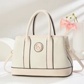 Beige woven tote bag with leather trim and gold logo on minimalist background - Off White