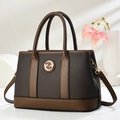 Elegant two-tone brown patchwork handbag with gold logo and adjustable strap - Coffee
