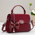Elegant wine red woven crossbody bag with leather bow and adjustable shoulder strap - Red