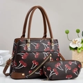 Close-up of cherry print handbag set with large tote and matching oval pouch - Coffee