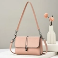 Pink soft leather shoulder bag with gunmetal buckle on minimalist stone stand - Pink