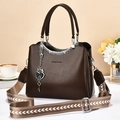 Dark brown faux leather tote bag with silver heart lock and wide patterned strap - Coffee