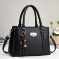 Black litchi grain satchel with silver lock and decorative charms for 2025 fashion - Black