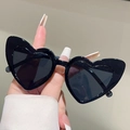 Close-up of heart-shaped black sunglasses for kids featuring a glossy frame and dark lenses - Black Frame Grey Lens