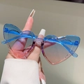 Detail of heart-shaped kids sunglasses with blue pink gradient lenses and blue frame - Blue-Pink Gradient Frame Blue-Pink Lens