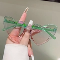 Detail of heart-shaped rimless sunglasses featuring a green to pink gradient lens design - Green-Pink Gradient Frame Green-Pink Lens