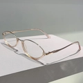 Detail of pink transparent frames with rose gold metal temples on a white stand - Gold and Champagne Frame Clear Lens