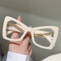 Detail view of stylish cream cat-eye glasses frame with thick temples and inside markings - Beige Frame Transparent Lens