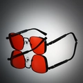 Detail view of steampunk square sunglasses with red lenses and spring metal legs - Black Frame Red Lens