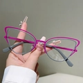 Macro detail of cat-eye glasses featuring pink and grey dual-layer metal frames - Outer Purple Inner Grey (Transparent Lens)