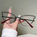 Macro detail of cat-eye metal glasses frame featuring dual-tone green and red finish - Outer Green Inner Dark Red (Transparent Lens)