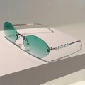 Detail of rimless oval sunglasses with green gradient lenses and pearl-decorated temples - Silver Frame Gradient Green