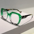 Detail of green and tortoiseshell cat-eye glasses frame with metallic hinge accents - Green Leopard Frame Clear Lens