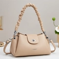 Detail of apricot large capacity handbag with scrunchie cloud handle and silver clasp - Khaki