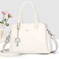 Detail of David Jones beige lychee leather handbag with silver cat charm and brand logo - Off-white