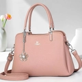 Elegant dusty pink litchi grain leather handbag with adjustable crossbody strap - Pink