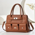 Detailed view of caramel brown pebbled leather tote bag with silver turn-lock and strap - Khaki/Earth Yellow