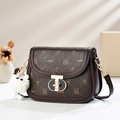 Dark brown leather saddle bag with cartoon animal prints and a fluffy white pendant - Coffee