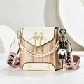 Detail of crossbody bag with flamingo metal buckle, pearl tassel and wide strap - White