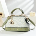 Fashionable bicolor shoulder bag with geometric pattern, top handle and detachable strap - Green