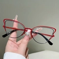 Cat eye glasses frame in red and black metal with heart-shaped rhinestone detail - Outer Red Inner Black (Transparent Lens)