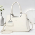 Detail of white litchi pattern leather handbag with silver hardware and logo - Off-white